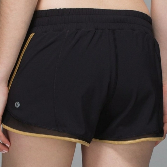 Lululemon Super Squad shorts. Black and gold. Size 6. Built in liner. - Picture 3 of 12